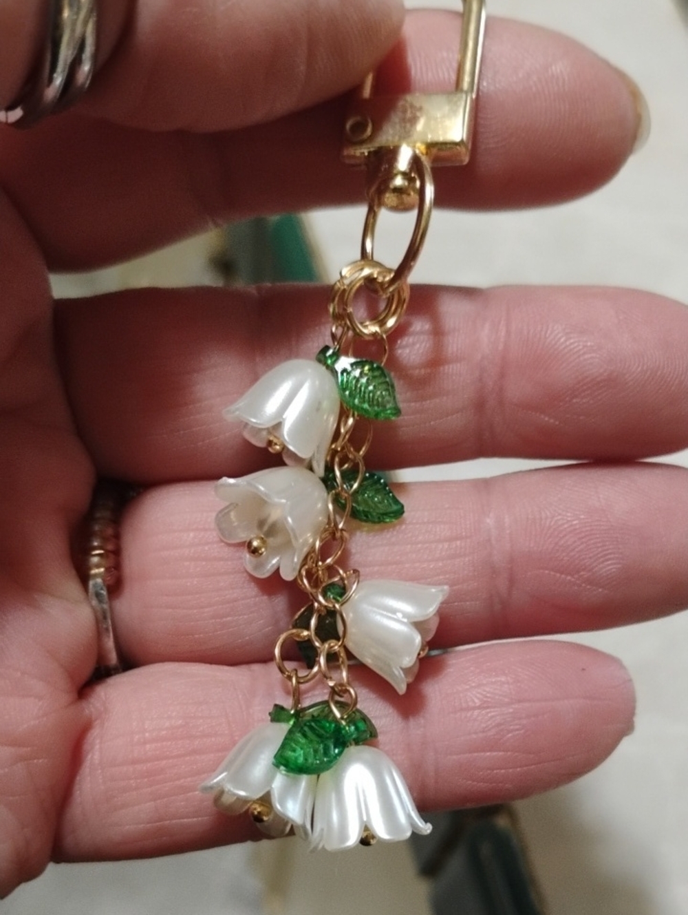 Gold-Tone White Floral Drop Bag Charm with White Petals and Green Leaves - Picture 2 of 2